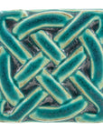 This Journey Knot Tile features the matte turquoise Pewabic Blue glaze.