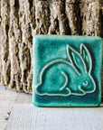 This ceramic Bunny Tile is featured in the matte turquoise Pewabic Blue glaze.