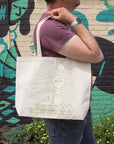 This cream tote bag's design is in a bright green color.
