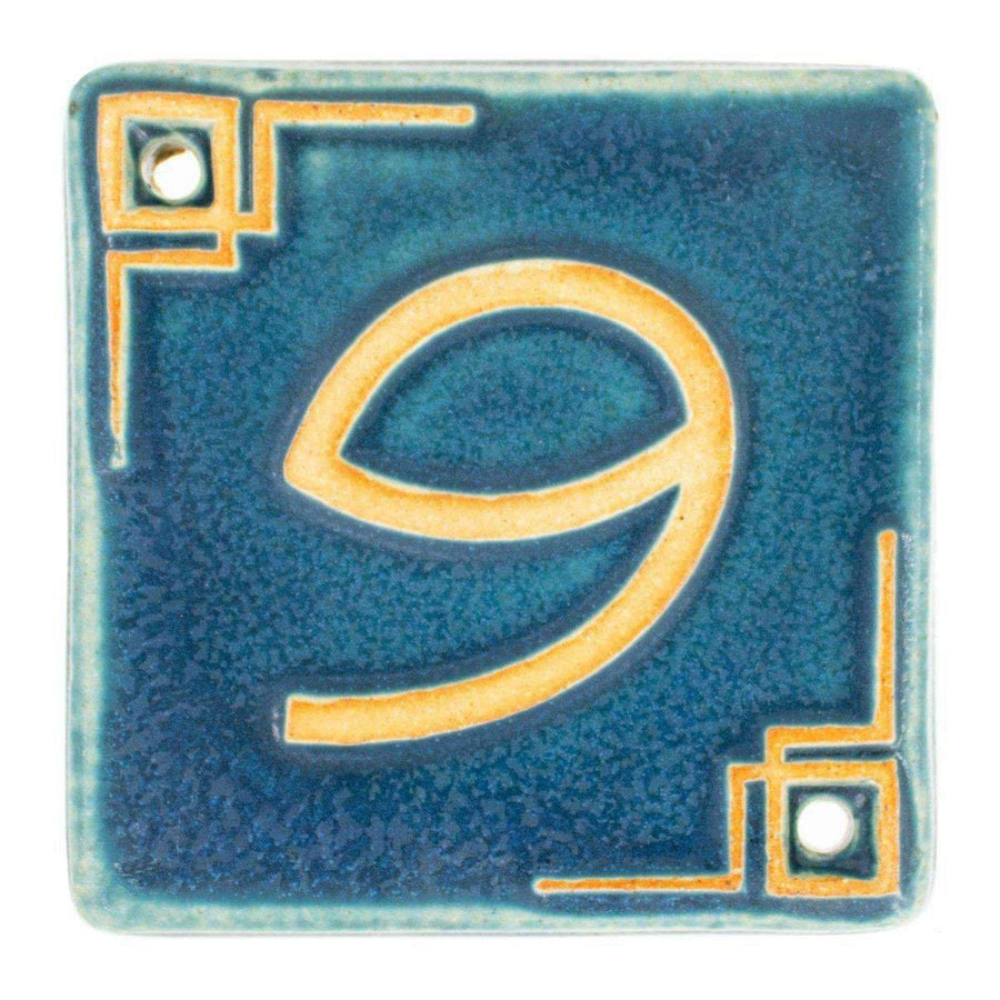The Craftsman style ceramic 9 address number is in the matte blue Peacock glaze option.