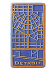 The raised areas of this tile - the word Detroit and the street lines - are scraped which means that it has an orange color while the background is a dark matte blue glaze.