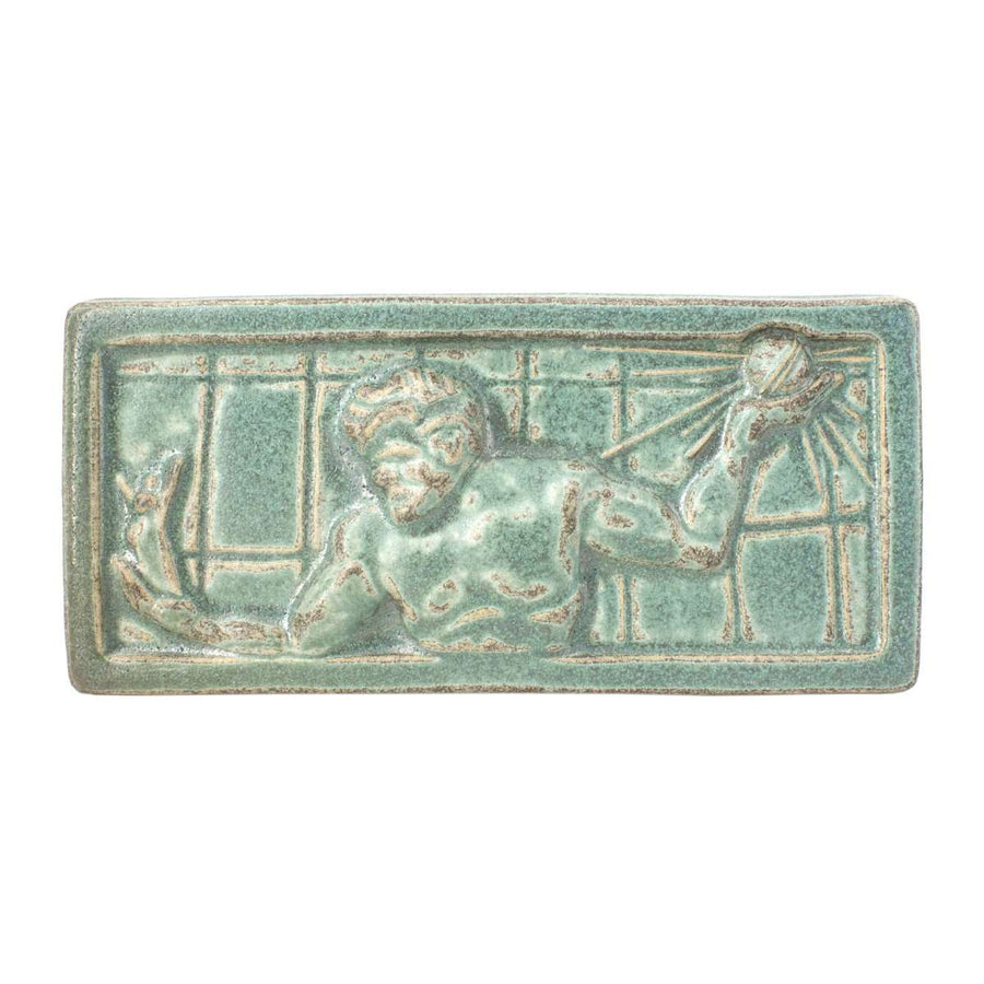 This tile features the mottled pale green Patina glaze. It has a similar look to the weathered green finish of copper.