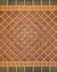 Bayleaf glazed tiles make up the trim of this foyer detail shot with a warm, chestnut glazed center.