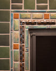 Corner shot of the iridescent glazed accent center of the bayleaf and chestnut fireplace.