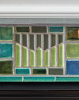 Blended blue and green fireplace and hearth.