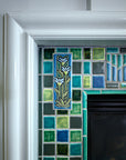 Blended blue and green fireplace and hearth.