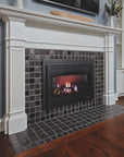 An angled view of a fireplace and hearth made up of charcoal and glossy black or "onyx" tiles.