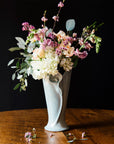 The glossy pale blue-gray color of the Frost glaze shines on this sleek Calla Lily vase.