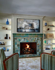 Vibrant, lit fireplace made up of Iridescent and matte glazes which creates an overall green, mirror-like effect.