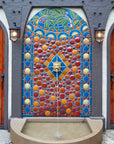 The intricate designed mosaic tile on this outdoor fountain mimics the circles and branches of the fountain at the Detroit Institute of Arts.
