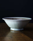 The Birch Harvest Bowl sits on a dark wood table.