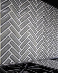 A closer detail of the herringbone pattern behind the stove.