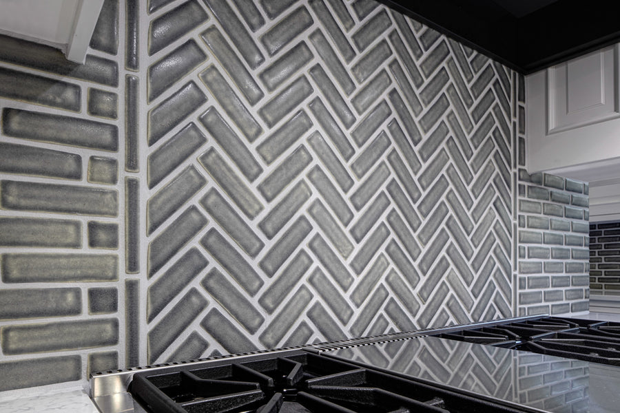 A closer detail of the herringbone pattern behind the stove.