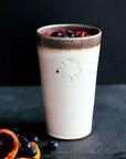This Birch Pint holds a colorful smoothy with blueberries and slices of blood orange.
