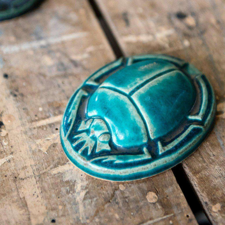 This paperweight features the matte turquoise Pewabic Blue glaze.