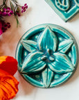 This tile features the matte turquoise Pewabic Blue glaze.