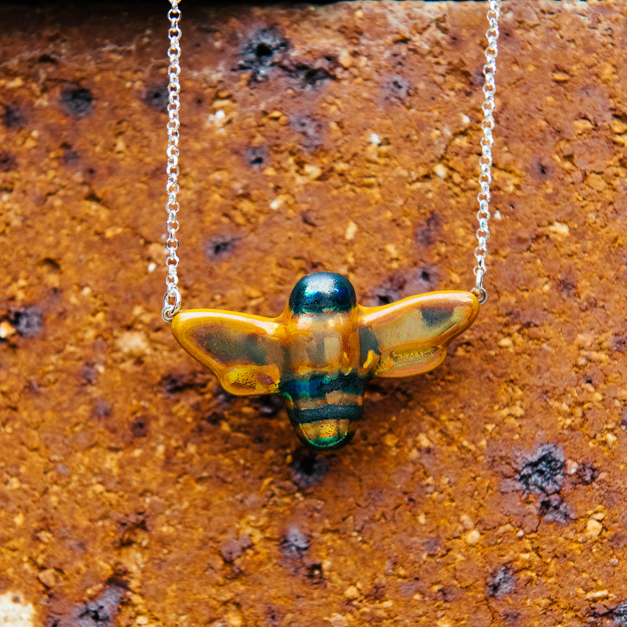Up close, the bee's iridescent glaze is reflective, making the colors change depending on the lighting.