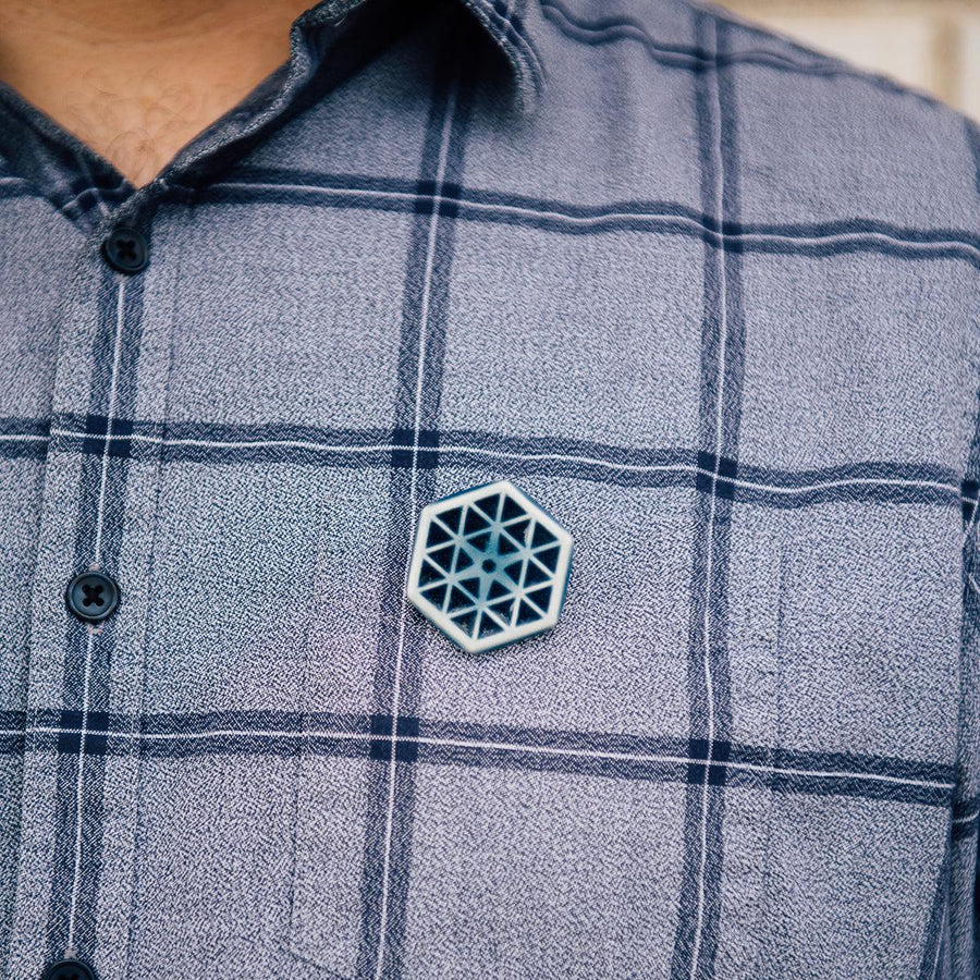 The Hex Pin features the glossy deep blue Ocean glaze.