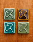 Four Ginkgo Tiles laid out in a square in four different glaze options.