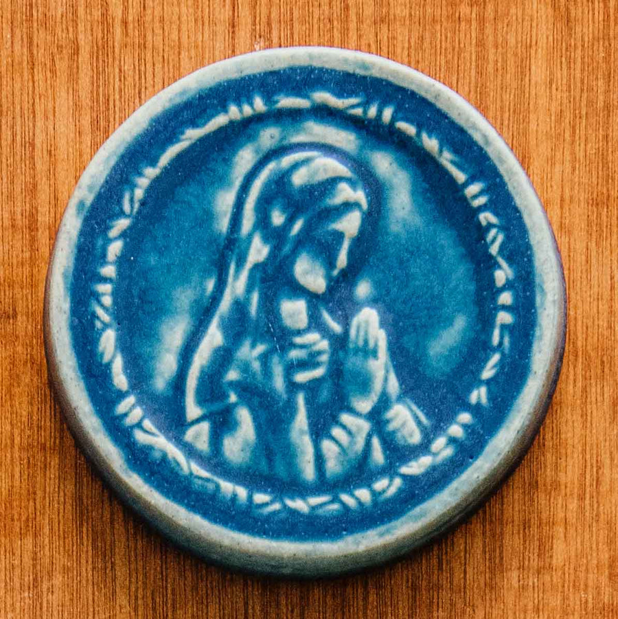 This ceramic Blessed Virgin Mary Tile is glazed in a matte blue Peacock glaze.