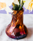This Copper Snowdrop vase has more pinks, reds and purples on its surface.