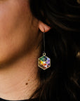 A detail of the earring shows the interlocking triangles on the Hex make a starburst shape near the center.