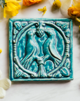 This Lovebirds Tile features the matte turquoise Pewabic Blue glaze.