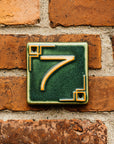 The Craftsman style ceramic 7 address number is in the matte green Leaf glaze option.