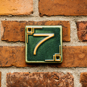 The Craftsman style ceramic 7 address number is in the matte green Leaf glaze option.