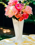 In the sun, the Calla Lily Vase in Birch glaze shows off the high relief design of the calla lily flower on its surface.