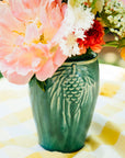 This vase features the matte blueish-green Pewabic Green glaze.