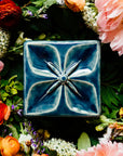The glossy Ocean Flower Geo Tile.