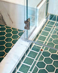 The shower floor also features the hexagonal shaped tiles.