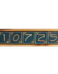 The light wooden address frame holds Charcoal deep gray numbers.