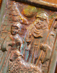 The Shepherds Tile features a man dressed in robes with his hand on the shoulder of a young boy. A sheep stands at their feet and the moon looks down at them through a large hole in the brick wall behind them.