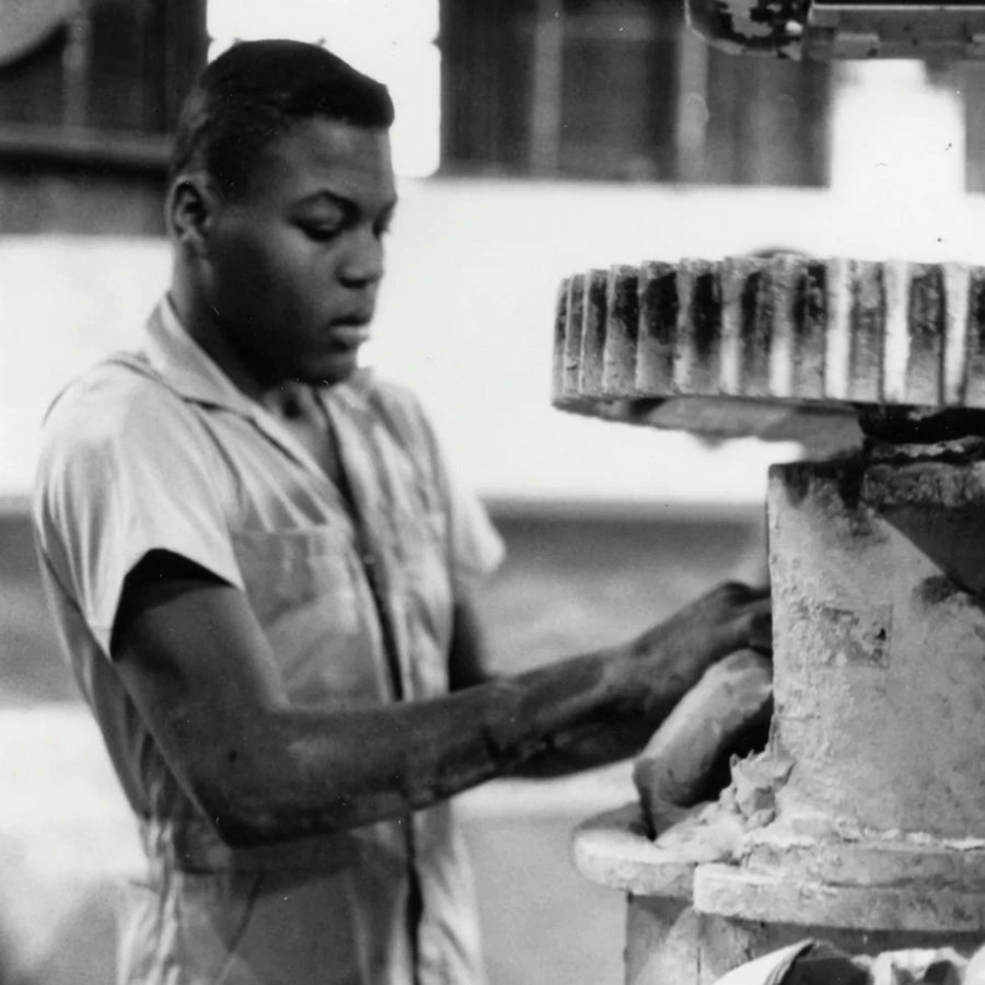 Former Pewabic employee Jerome working the clay mixer in 1983.