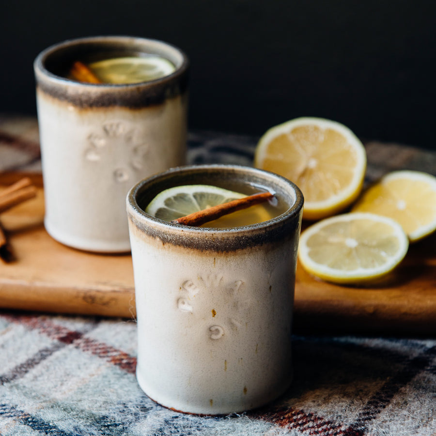 These Rocks cups feature the creamy white Birch glaze that has some brown speckling. The inner lining and lip of the cup have a mottled gray color.