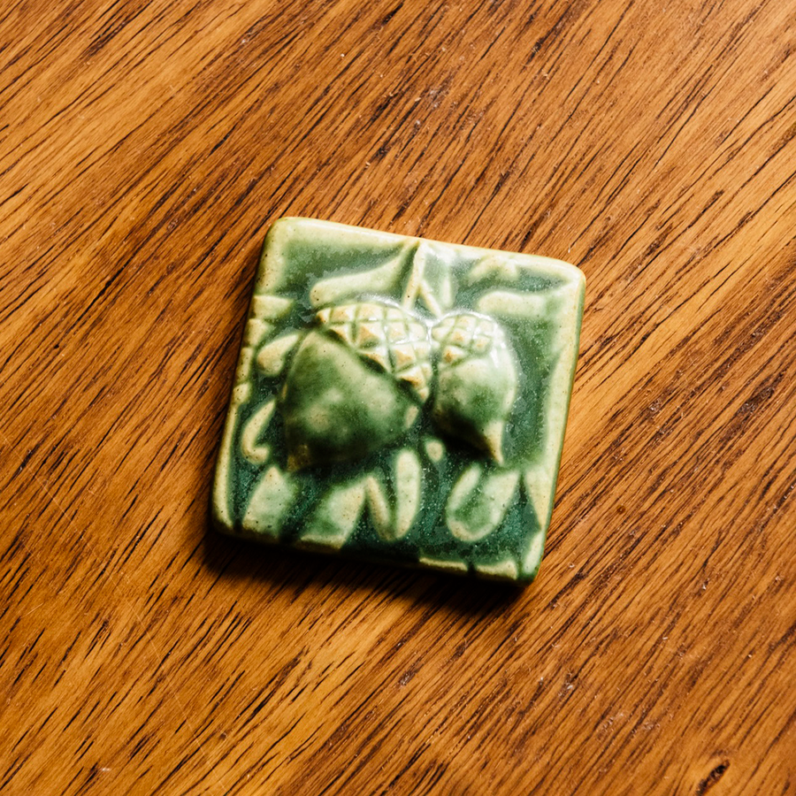 This 3x3 ceramic acorn tile is in the matte green Leaf glaze option.