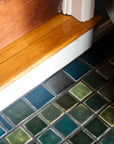Detailed shot of 3x3 tiles in blue and green surrounded by 3x4 border tiles in grey and blue.