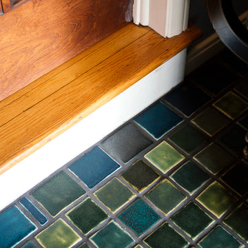 Detailed shot of 3x3 tiles in blue and green surrounded by 3x4 border tiles in grey and blue.