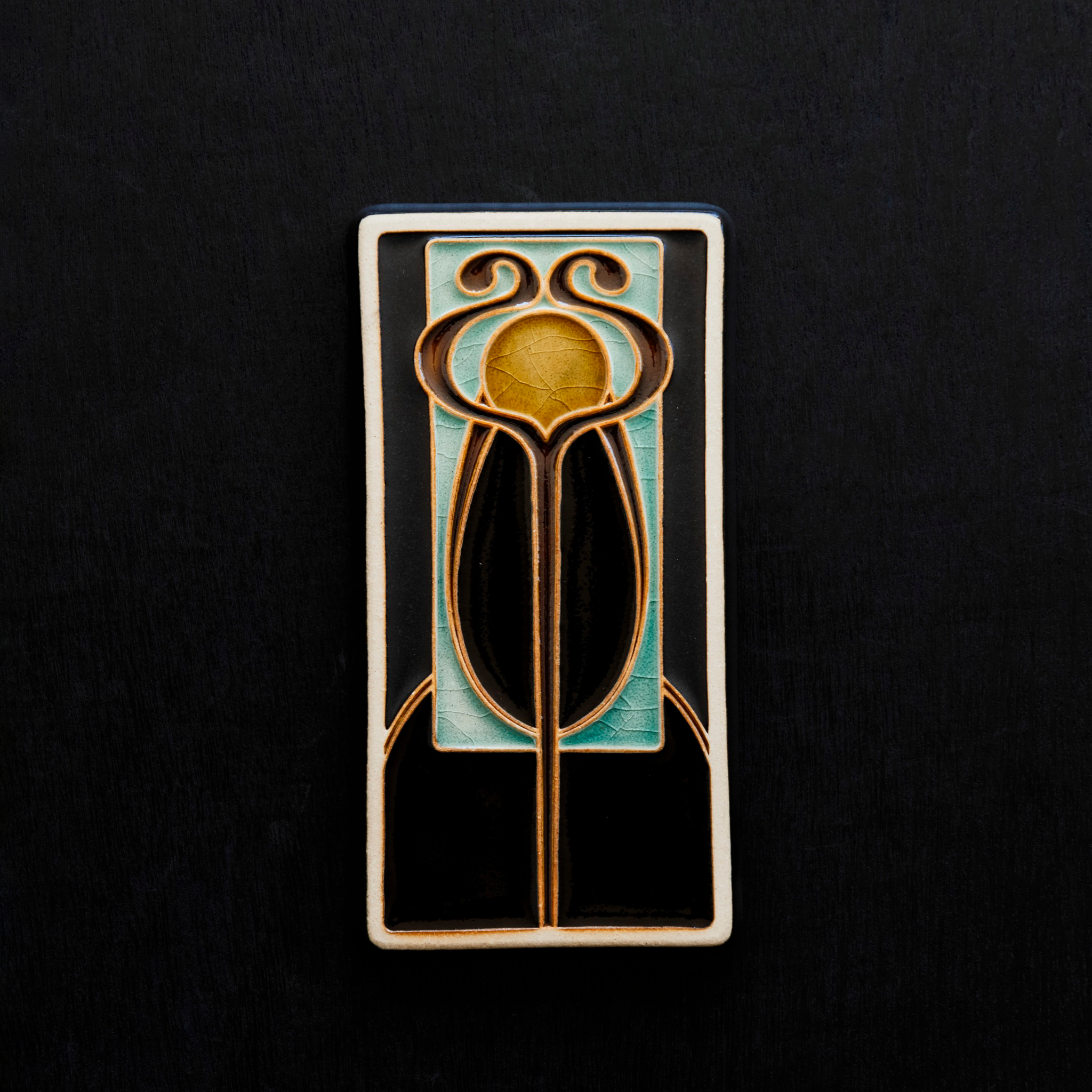 A Hand-Painted Stickley Tile in our glossy, multi-colored "Obsidian" palette. 