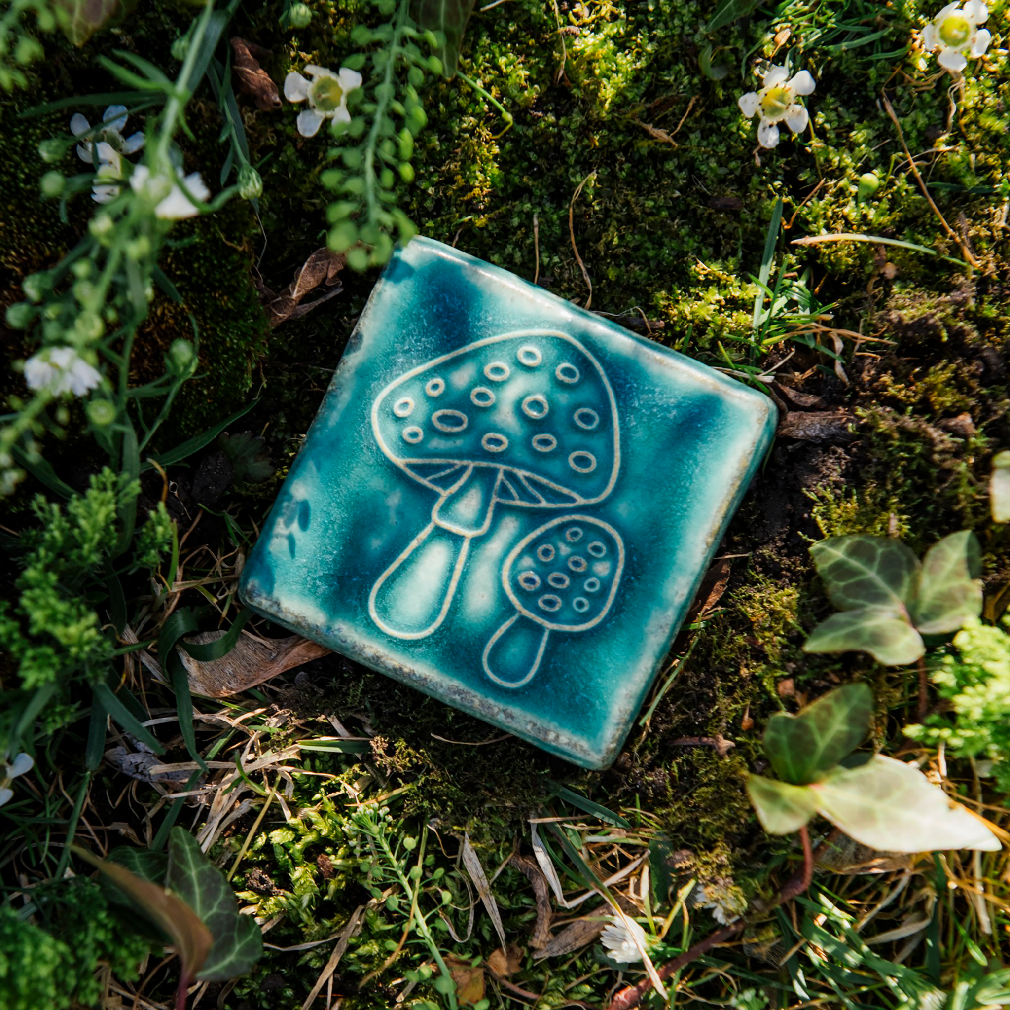 This tile features the matte turquoise Pewabic Blue glaze.