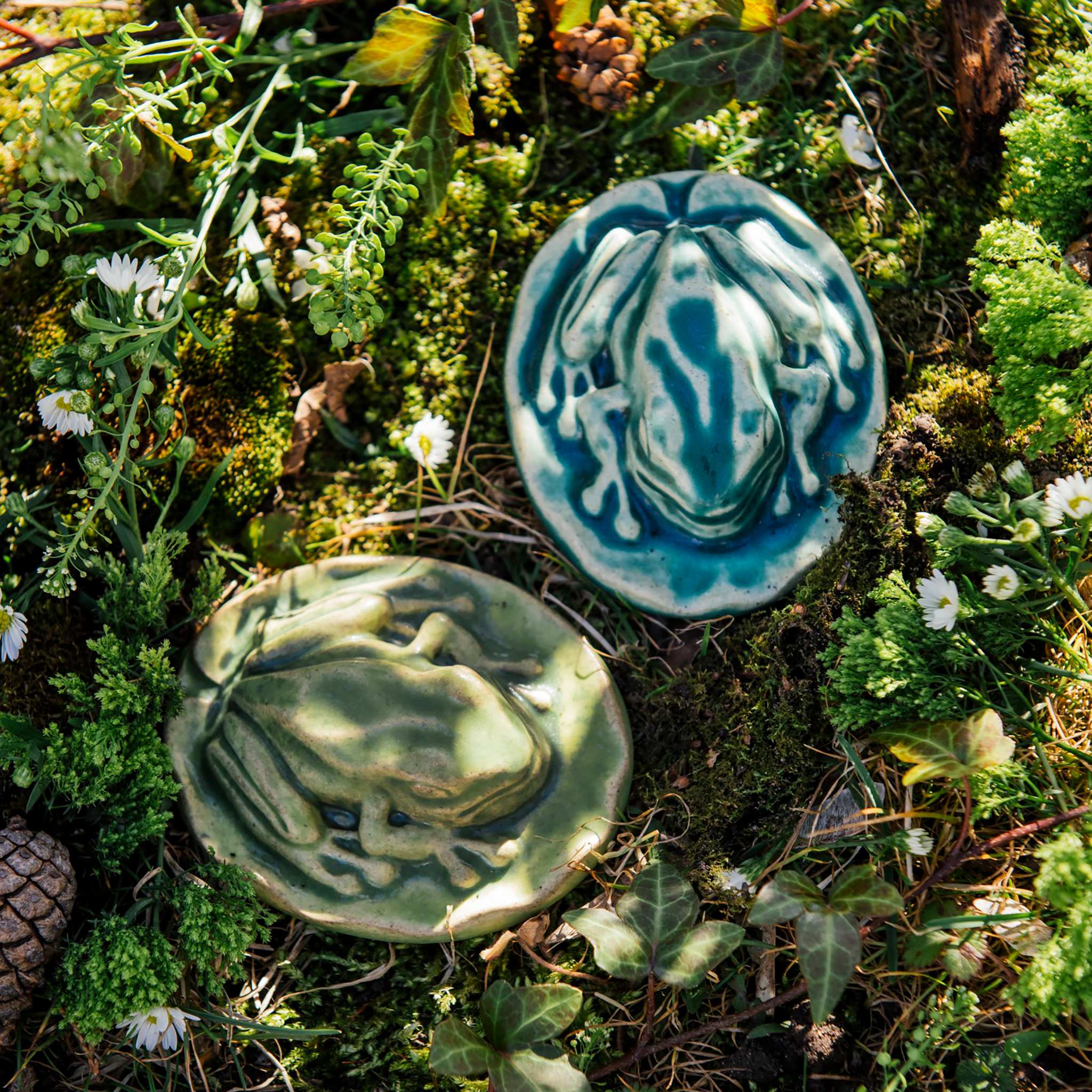 The Frog Paperweight has an oval bottom in the shape of a small lily pad. The high-relief tree frog sits on top- this paperweight is detailed and thick.