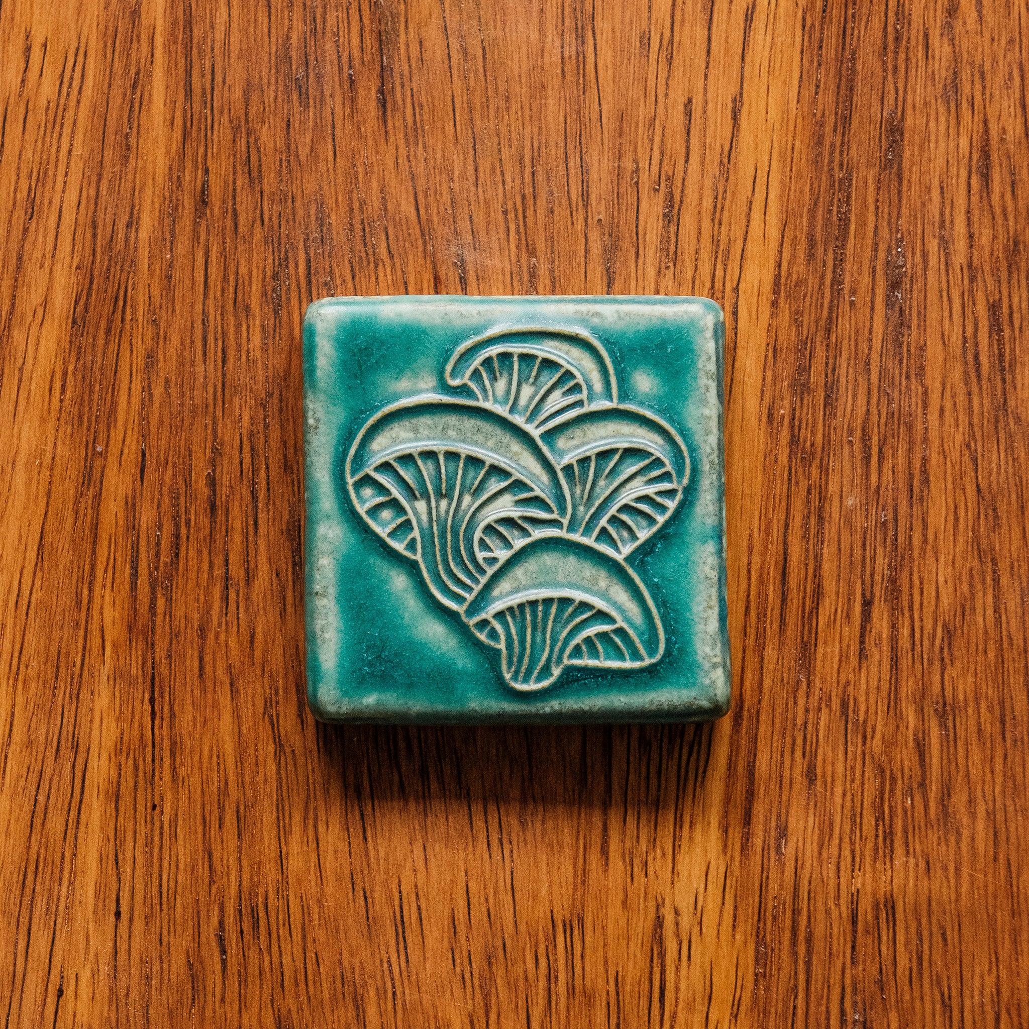 This tile features the matte turquoise Pewabic Blue glaze.