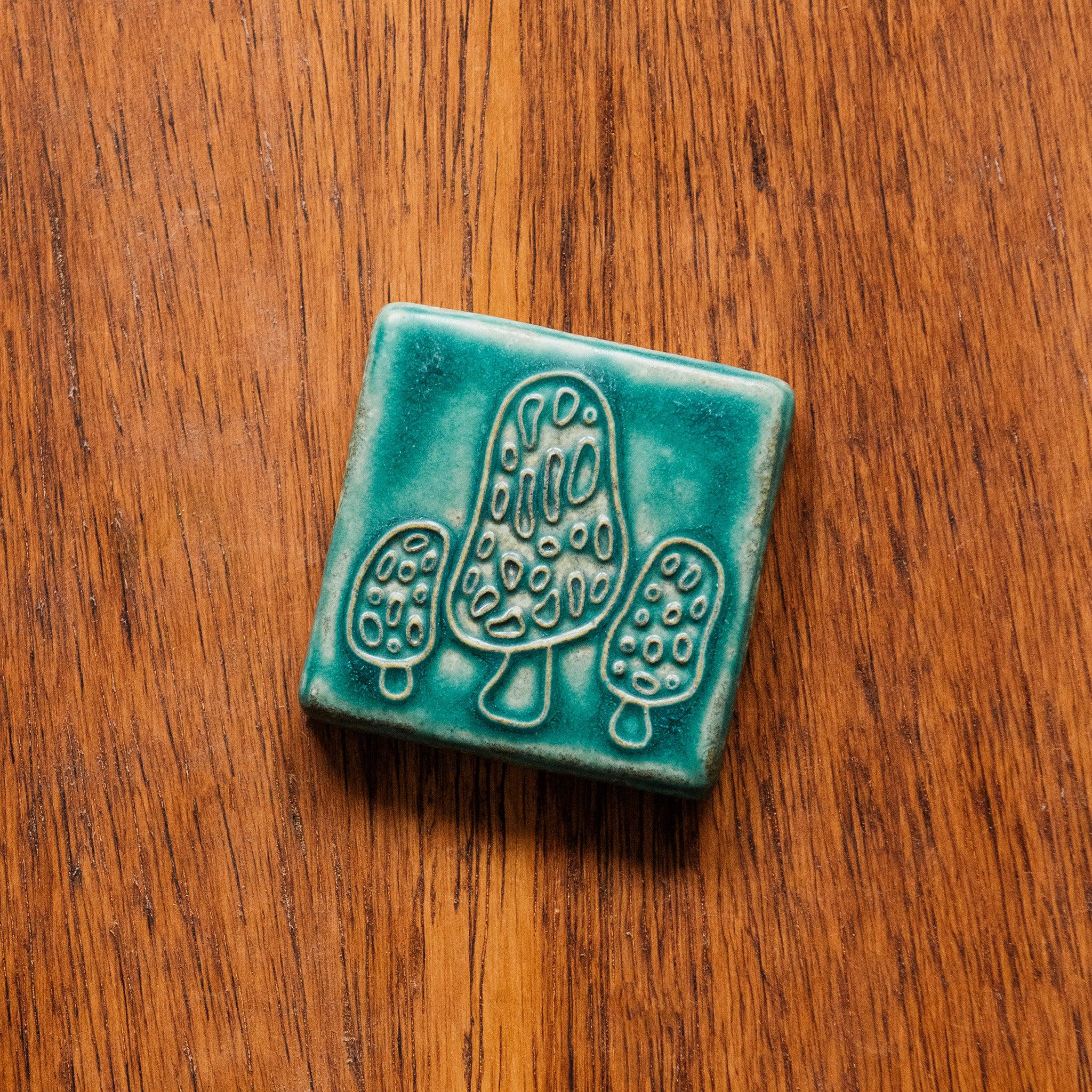 This tile features the matte turquoise Pewabic Blue glaze.
