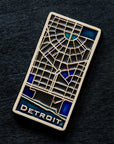 This hand painted tile is black with blue accents differentiating the water of the Detroit River and other specific areas of downtown including Campus Martius.