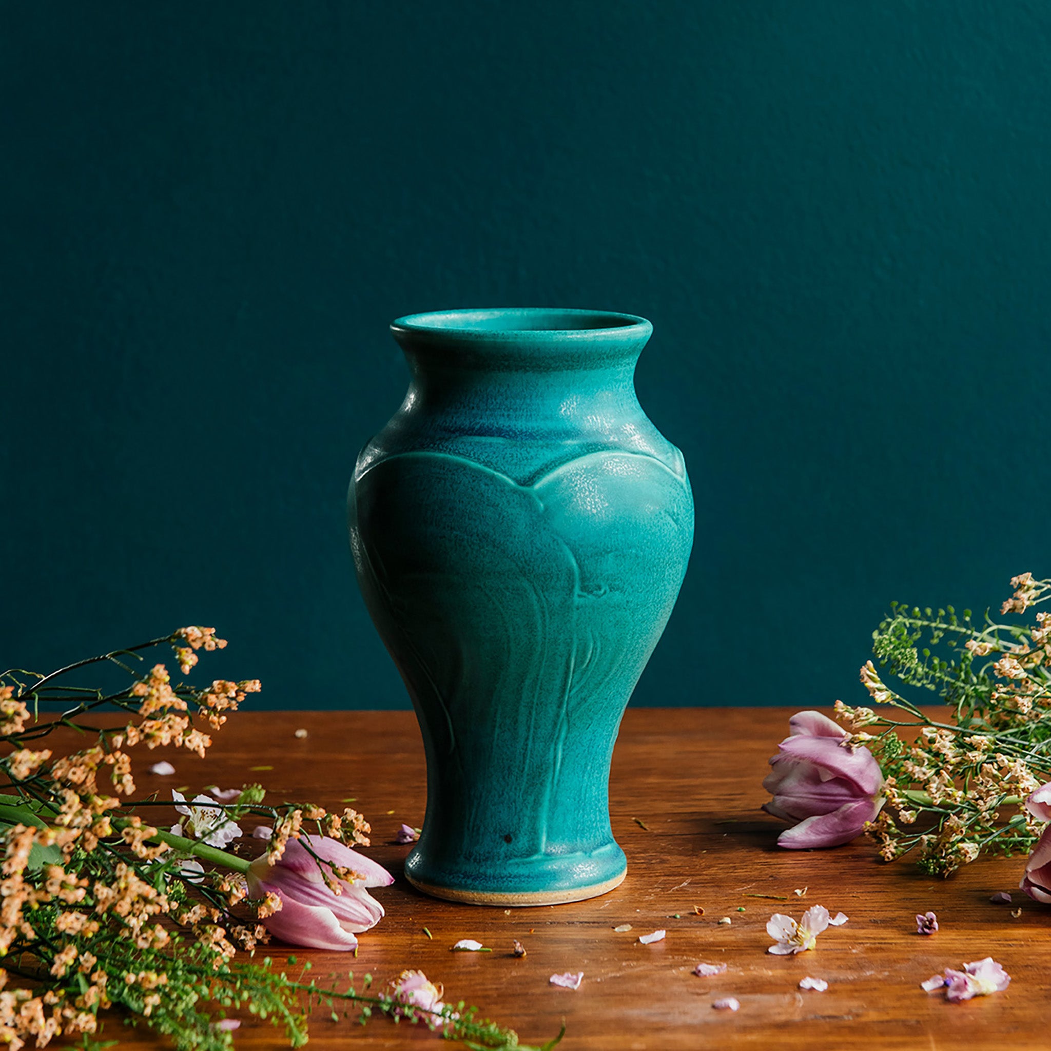 This vase features the matte turquoise Pewabic Blue glaze.
