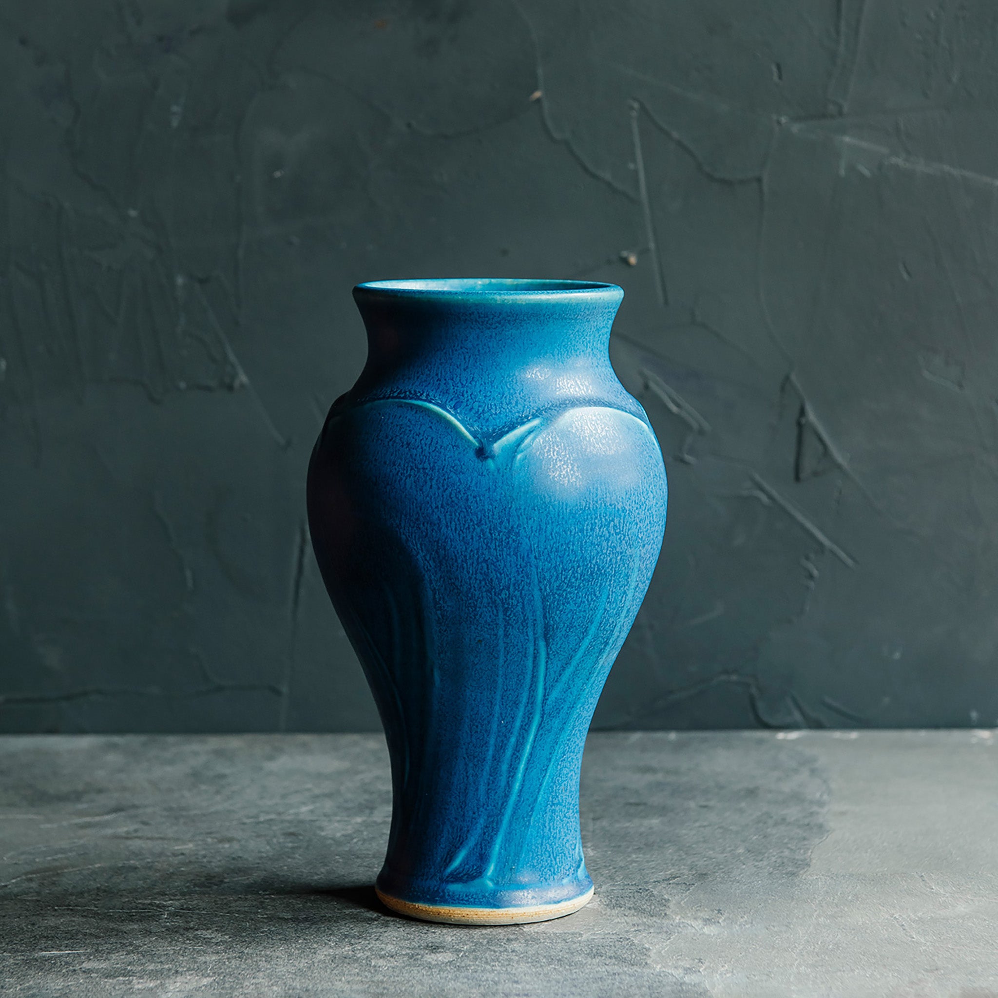 This Classic Vase features the matte french blue Peacock glaze.