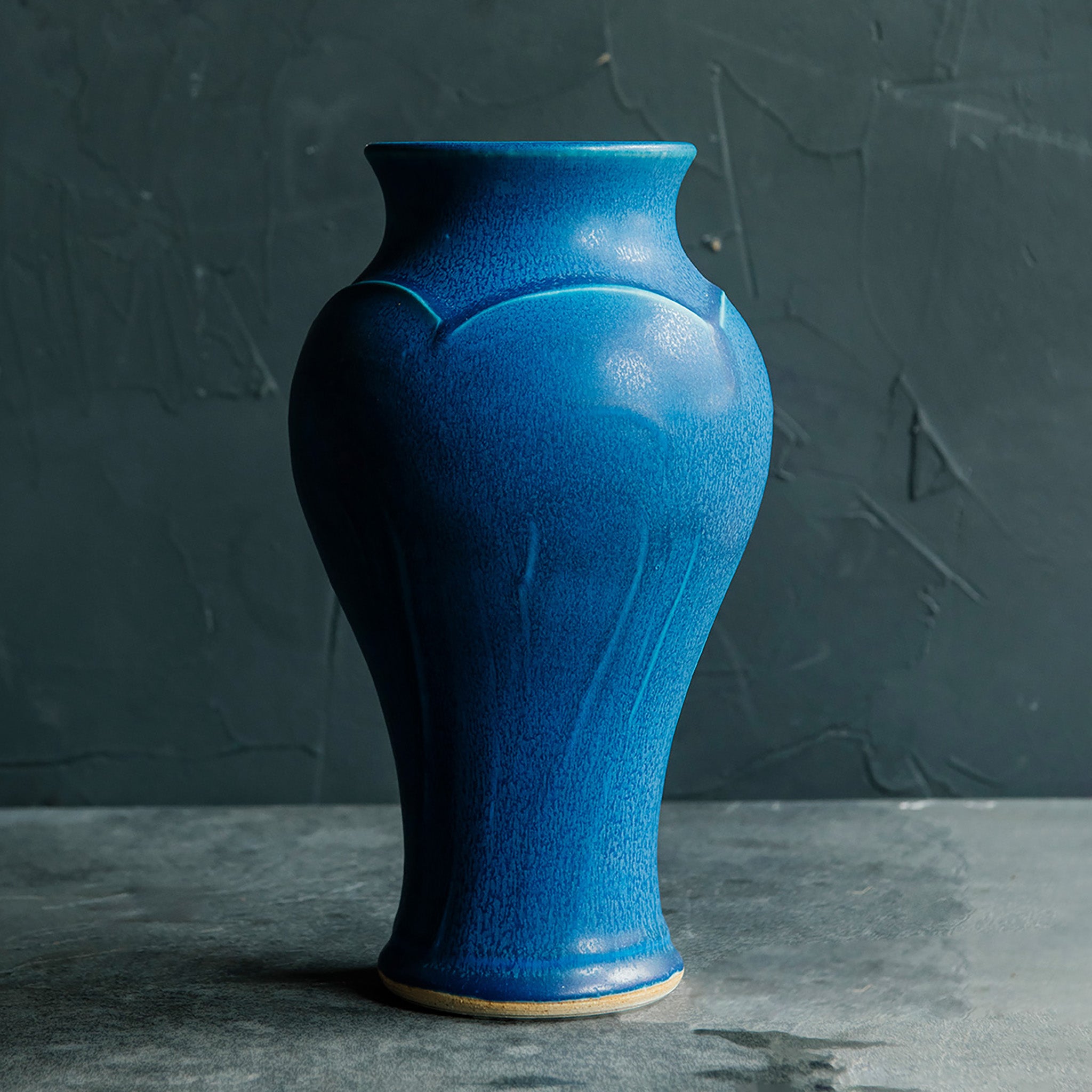 This Classic Vase features the matte french blue Peacock glaze.