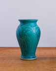 This vase features the matte turquoise Pewabic Blue glaze.